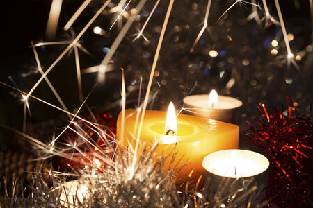 Christmas candles and sparks on a dark backgroundの写真素材
