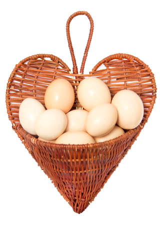 Eggs in the reed heart basketの写真素材