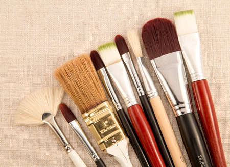 Painting brushes on a linen background