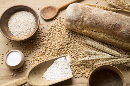 Home made bread, wheat and kitchen utensils