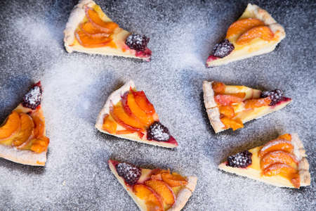 Fruit tart with powder sugar backgroundの写真素材