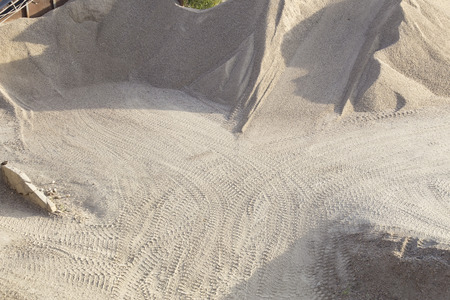 Construction sand pile with tire tracksの写真素材