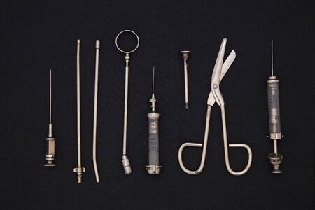 Antique medical tools on a black backgroundの写真素材