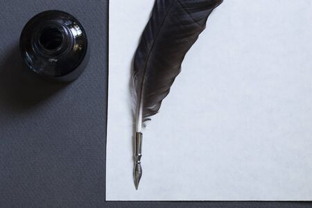 Vintage writing set with a white sheet of paperの写真素材
