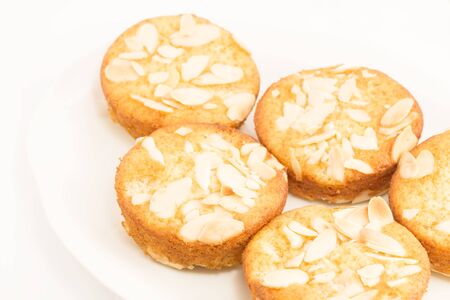 Almond muffins on a white plateの写真素材