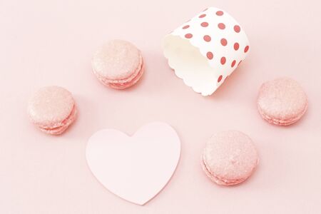 Pink macaroons with the blank heart shape note