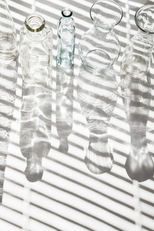 Various glass vintage bottles with the shadowsの写真素材