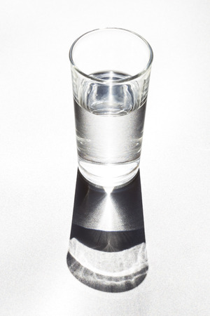 Glass of water with the shadowの写真素材