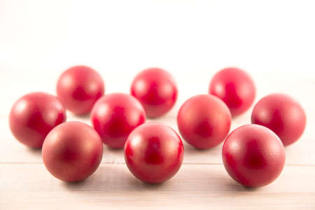 Red Easter eggs on white wooden backgroundの写真素材