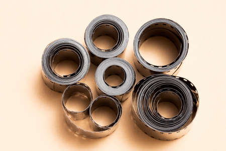 Film strip rolls on cardboard background - toned imageの写真素材