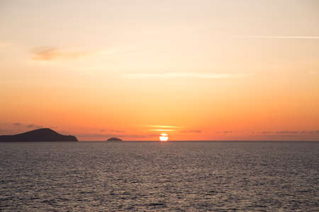Orange sunset over the seaの写真素材