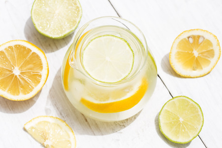 Detox drink with lemon on white wooden backgroundの写真素材