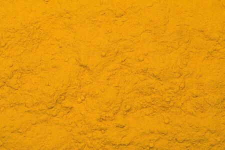 Tumeric - curcuma spice texture as backgroundの写真素材