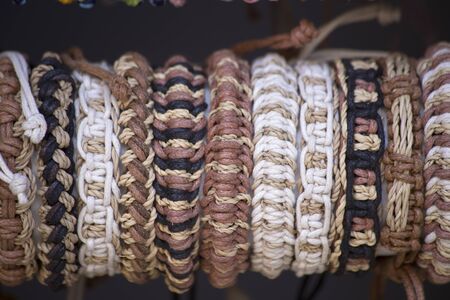 Leather and thread knotted braceletsの写真素材