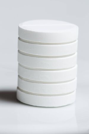 White pills on gray backgroundの写真素材