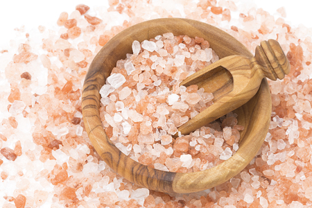 Himalayan pink salt in a wooden bowlの写真素材