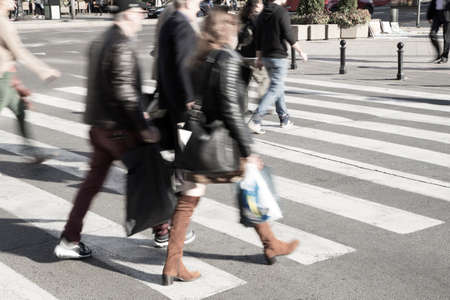 People crossing a street - blurred imageの写真素材