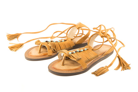 Indian leather slippers isolated on whiteの写真素材