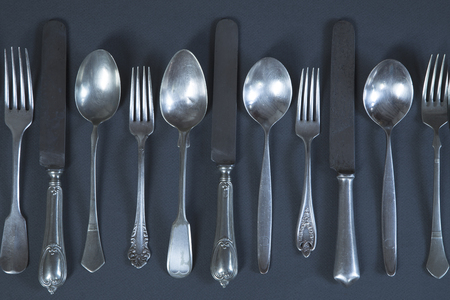 Vintage cutlery on gray background