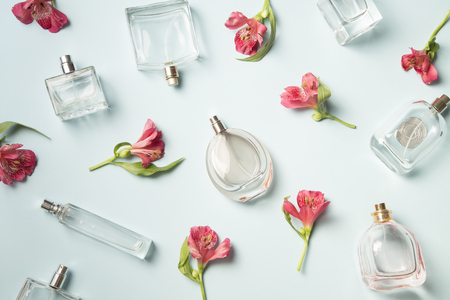 Perfumebottles and the wild orchids backgroundの写真素材