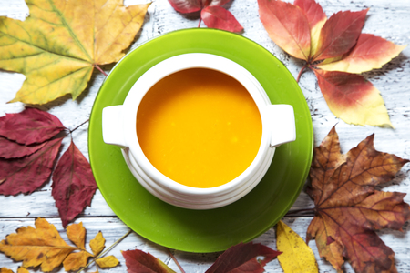 Pumpkin soup with the dry fall leavesの写真素材