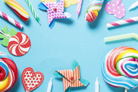 Birthday candies and accessories on blue backgroundの写真素材