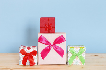 Various holiday presents on wooden background