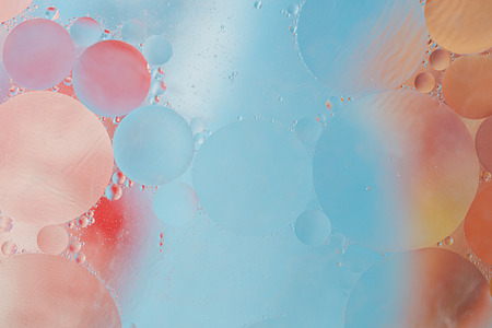 Oil drops in water - a colorful abstract backgroundの写真素材