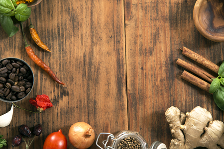 Various herbs and spices on grunge wooden background from aboveの写真素材