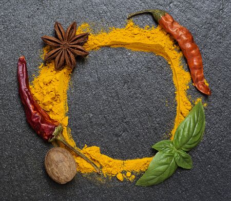 Spices frame on black granite boardの写真素材