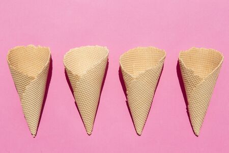 Ice cream cones on pink backgroundの写真素材