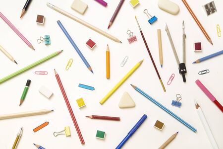 School supplies on white paper background - top viewの写真素材