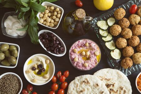 Vegan meal - hummus and falafel with vegetables and pita breadの写真素材