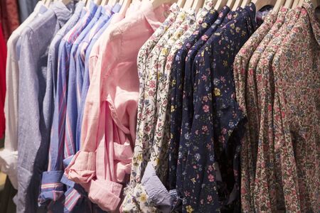 Colorful cotton shirts in a shopの写真素材