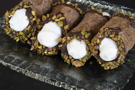 Cannoli, italian dessert served on a plate