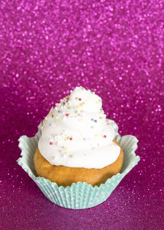 Birthday cupcake on purple backgroundの写真素材