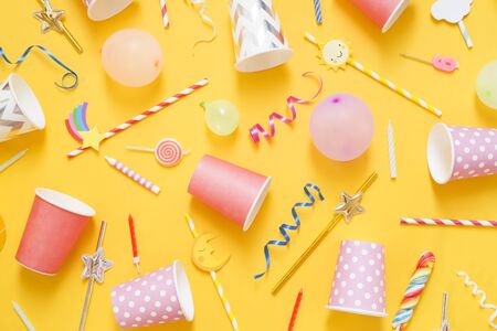 Party accessory on yellow background - top view