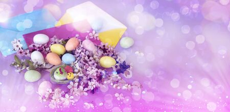 Easter eggs with blank envelopes and cherry blossomの写真素材