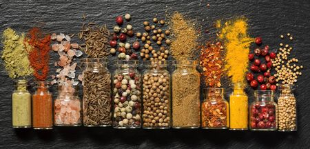 Various spices in small bottles