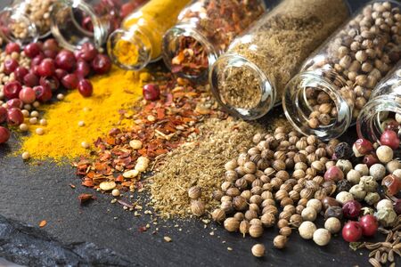 Various spices in small glass bottles