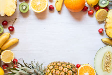 Tropical fruit on white wooden backgroundの写真素材