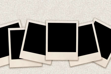 Blank instant images over grunge wall background