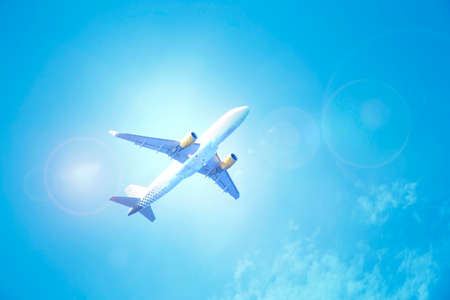 Airplane flying over white clouds