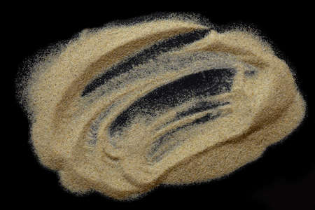 Brown sand on black background