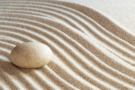 Single stone in a japanese zen gardenの写真素材