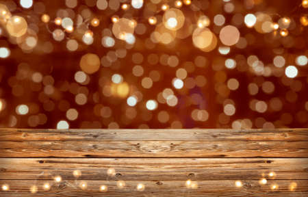 Holiday glitter light background with firework and wood copy space