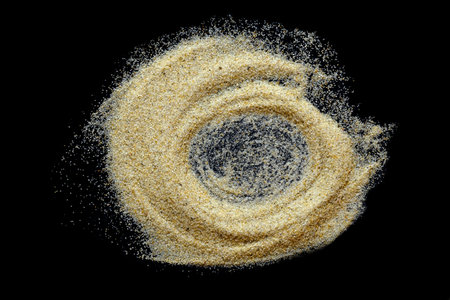 Sand heap on black backgroundの写真素材