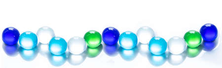 Colorful marbles on white backgroundの写真素材