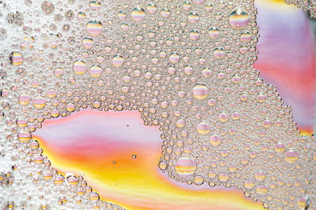 White foam over colorful background