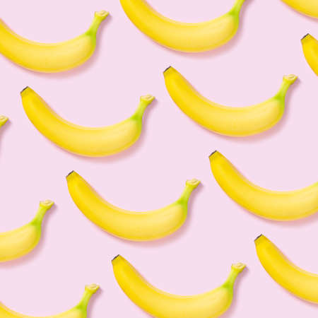 Yellow banana pattern on pink background
